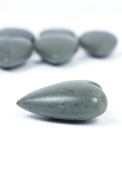 6 grey hand-carved stone hearts