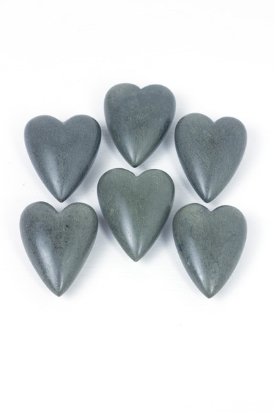 6 grey hand-carved stone hearts