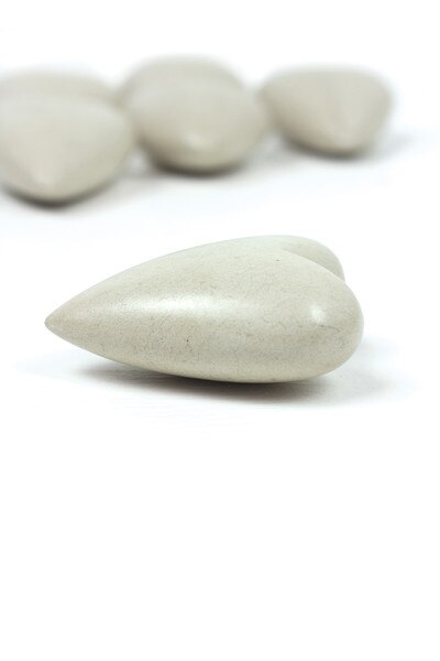 6 white hand-carved stone hearts