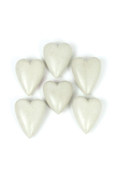 6 white hand-carved stone hearts