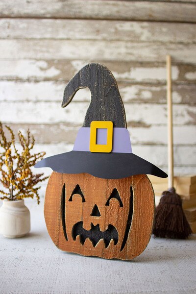 painted wooden jack-o-lantern with stand
