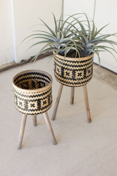 set of two woven black & natural bamboo plant stands with wood legs