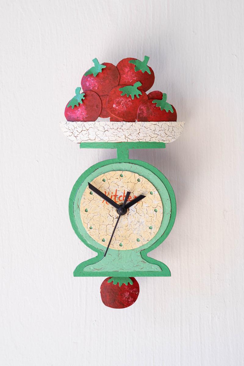 hand-painted tomatoes on scale wall clock with moving pendulum