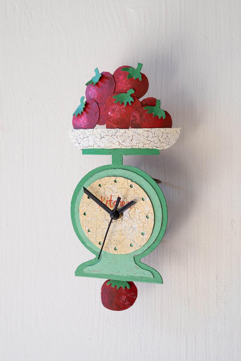 hand-painted tomatoes on scale wall clock with moving pendulum