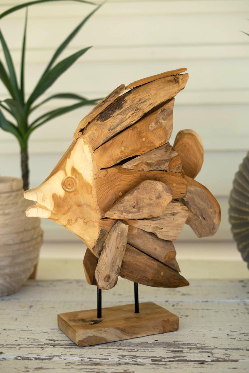 teak angel fish on a stand