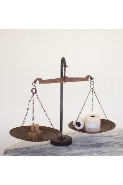 antique metal scale withweighted iron base